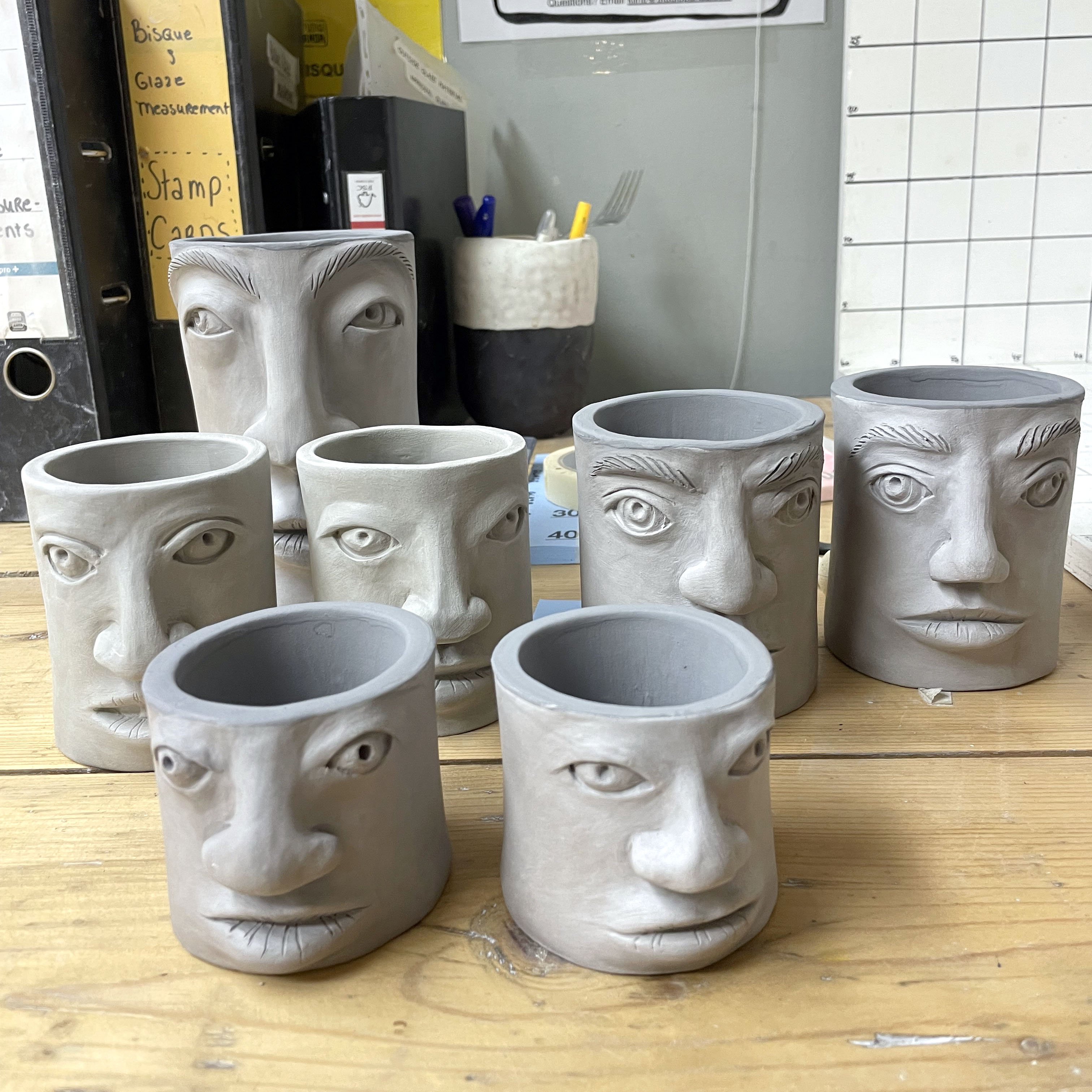 Seven face vessels lined up for firing