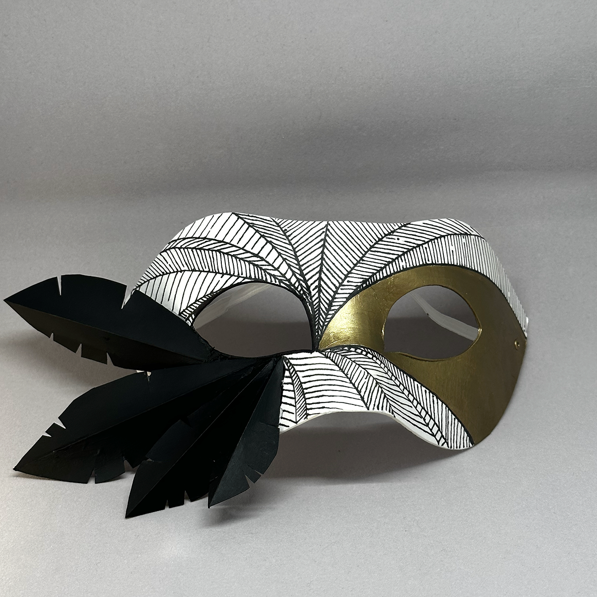 mask with fern leaf pattern